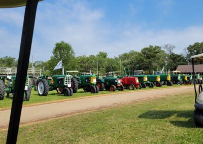 A number of tractors are parked